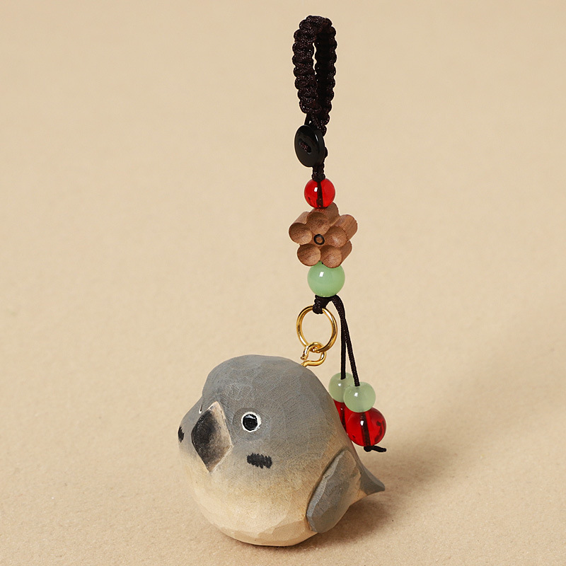 Wood carving gray parrot - peach wood plum blossom