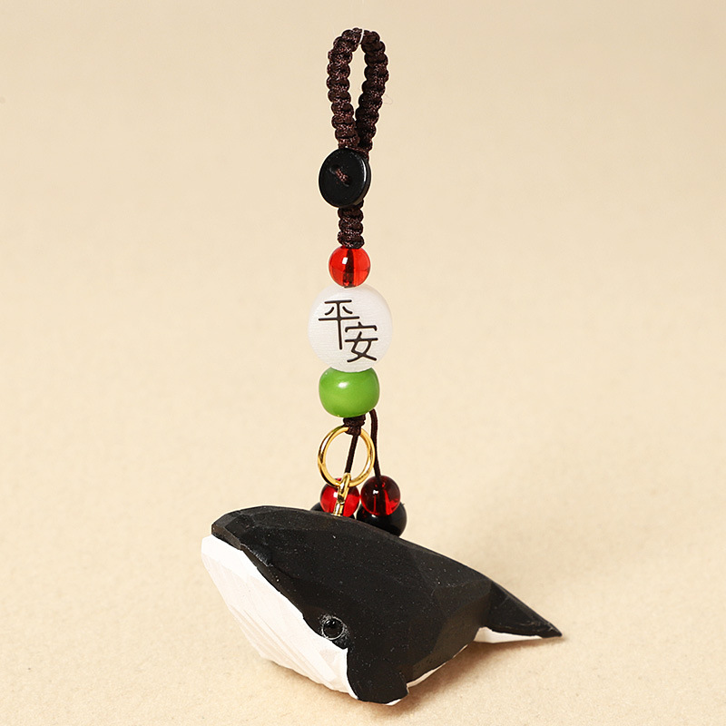 Wood carving striped black whale-safe model