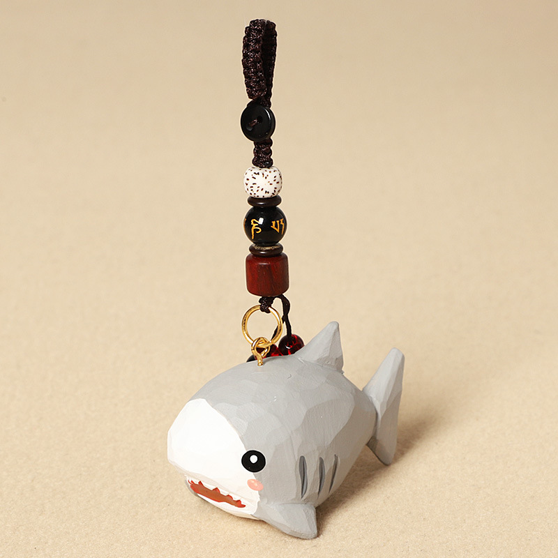 Wood carving of a big shark-six-character mantra