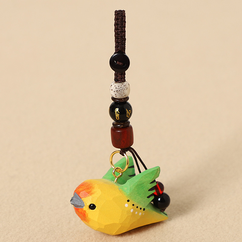 Wood-carved green bird with wings - Six-character