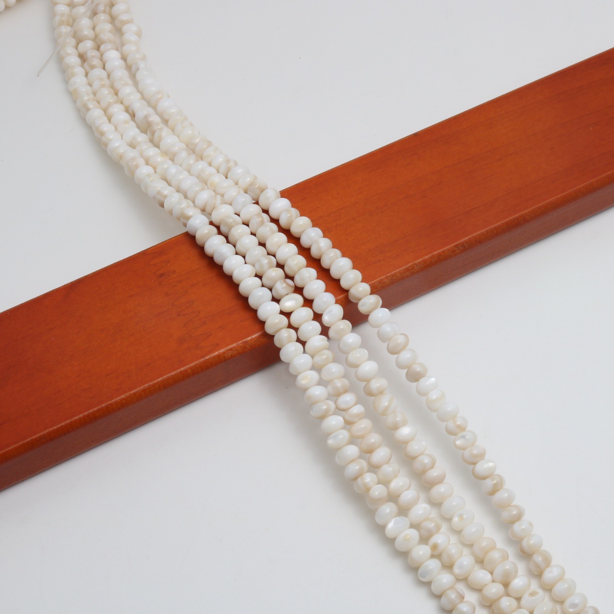 Milky white 3.5x5mm (about  105 Pc/Strand)